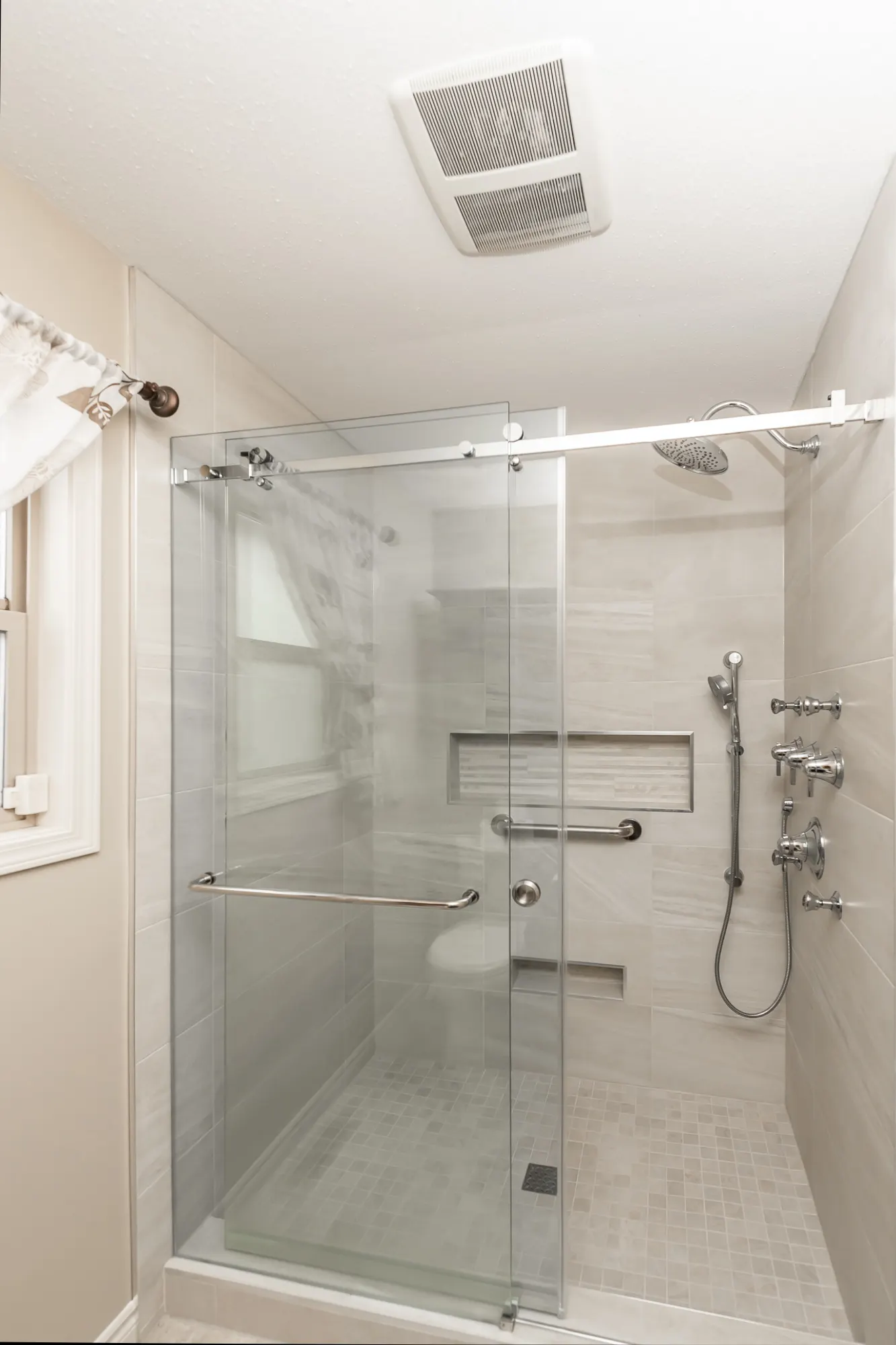 Accessible walk-in shower with elegant supports in Agassiz by Master Painting & Renovations