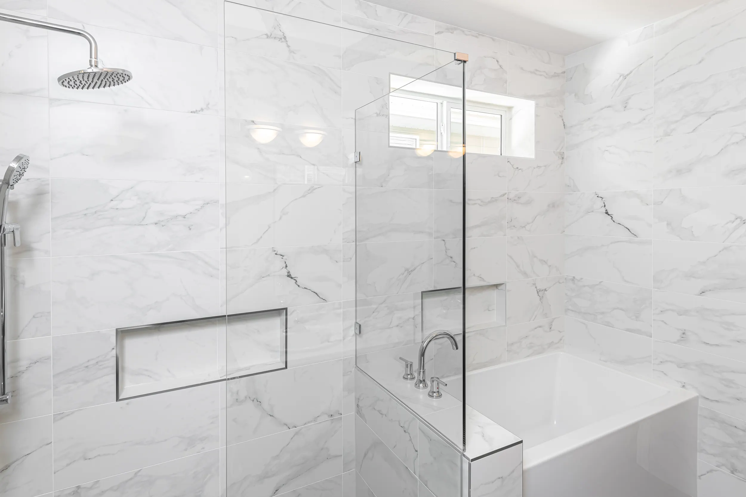 Bright marble bathroom vanity designed for comfort and ease by Master Painting & Renovations